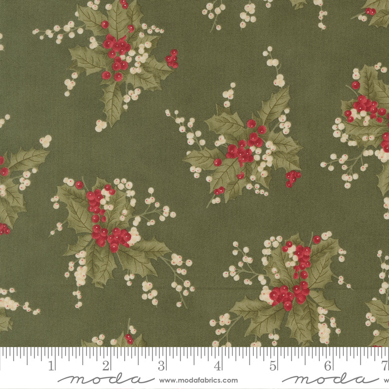 Fabric with holly berry pattern on a green background, featuring ruler.
