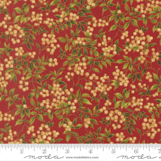 Fabric pattern with green leaves and beige berries on a red background, featuring a ruler for scale.
