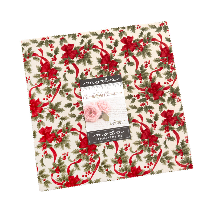 Christmas-themed fabric with red ribbons and green holly leaves, featuring Moda label.