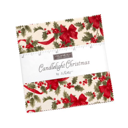 Pack of fabric squares with Christmas pattern and ruler on a white background
