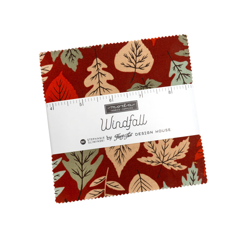 Fabric swatch with leaf pattern and ruler on a white background