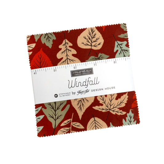 Fabric swatch with leaf pattern and ruler on a white background