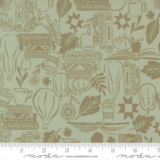 Fabric pattern with books, leaves, and pumpkins on a light green background, featuring ruler.