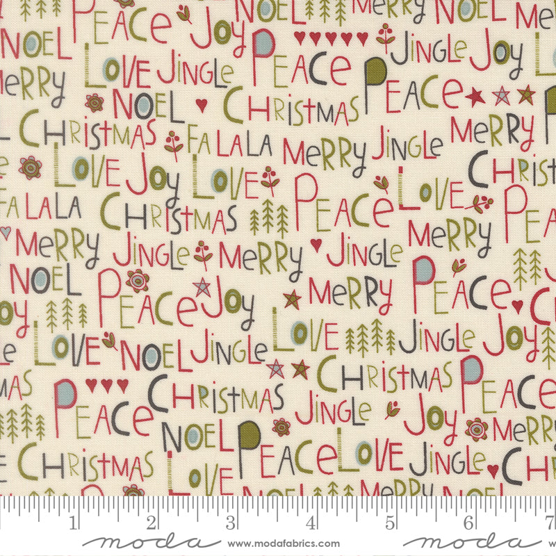 A close-up of a repeating Christmas-themed fabric pattern on a cream background, featuring words like 'Merry', 'Joy', 'Peace', 'Love', 'Christmas', and 'Noel' in red, green, and gray, with a ruler along the bottom showing scale.