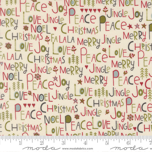 A close-up of a repeating Christmas-themed fabric pattern on a cream background, featuring words like 'Merry', 'Joy', 'Peace', 'Love', 'Christmas', and 'Noel' in red, green, and gray, with a ruler along the bottom showing scale.
