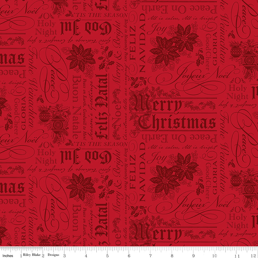 Red fabric with Christmas-themed text and poinsettia patterns on a white ruler background