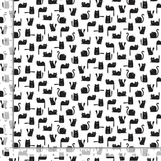 Black cat silhouette patterned fabric shown flat with ruler markings along the left and bottom edges to indicate scale.