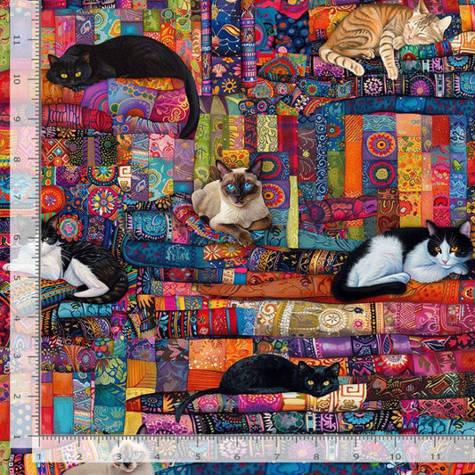Colorful quilt with cats on a patterned background