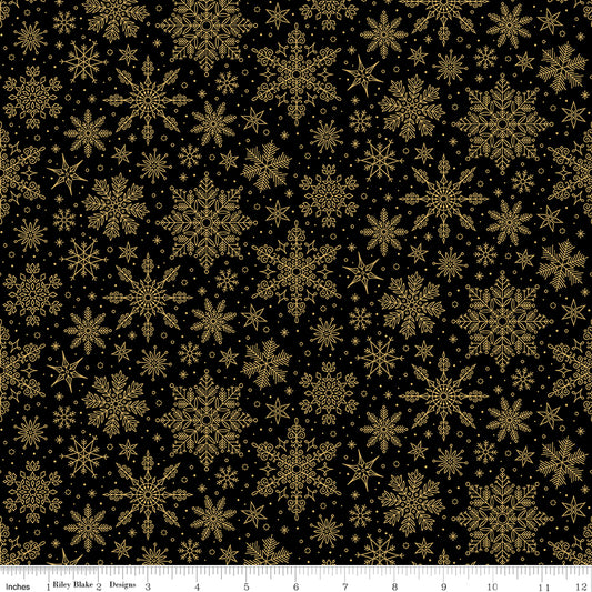 Pattern of gold snowflakes on a black background