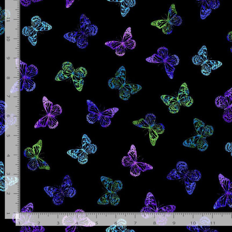 Colorful butterfly pattern on a black background with a ruler for scale.