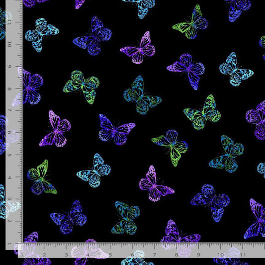 Colorful butterfly pattern on a black background with a ruler for scale.