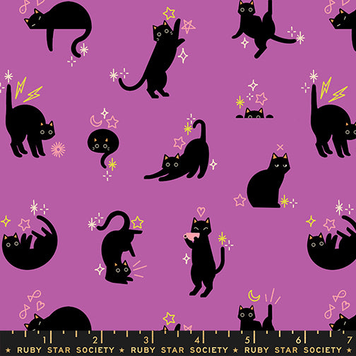 Pattern of black cats on a purple background with decorative elements, featuring the Ruby Star Society label.
